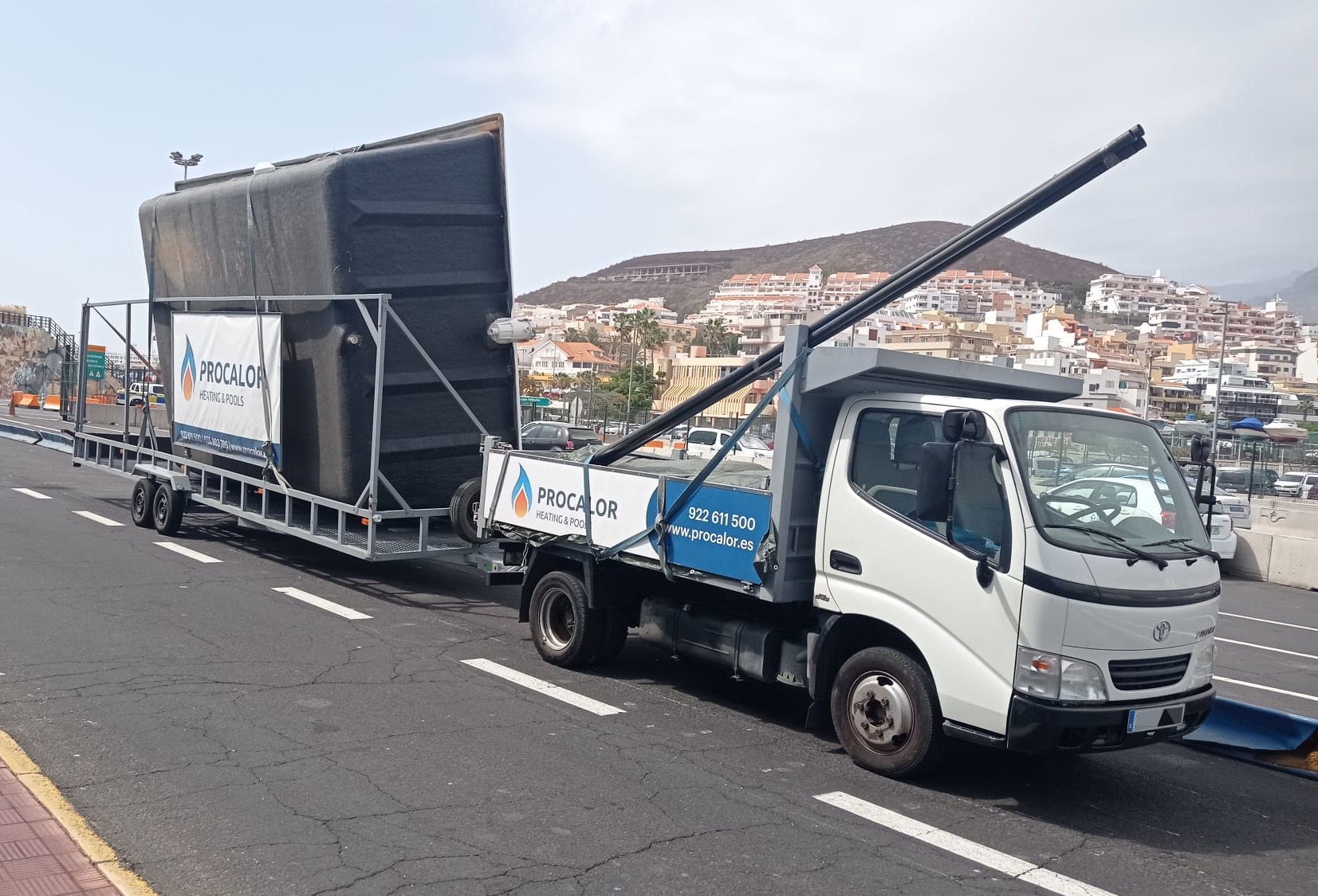 PROCALOR truck and trailer loaded with a compact pool at the port of Los Cristianos (Tenerife)
